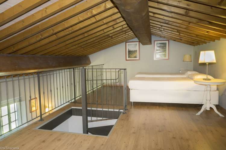 Bilde av hemsen med to enkeltsenger i ferieleiligheten Pinot Grigio på vingården.