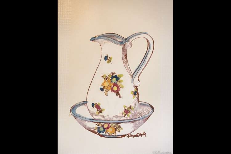 Bildet viser dekorasjon på baderomsflise i feriehuset Casa Rosa i Italia.