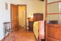 Bildet viser et soverom med to enkeltsenger i feriehuset Villa Verde.