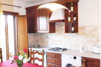 Bildet viser spiseplass på gårdsferie i Toscana.